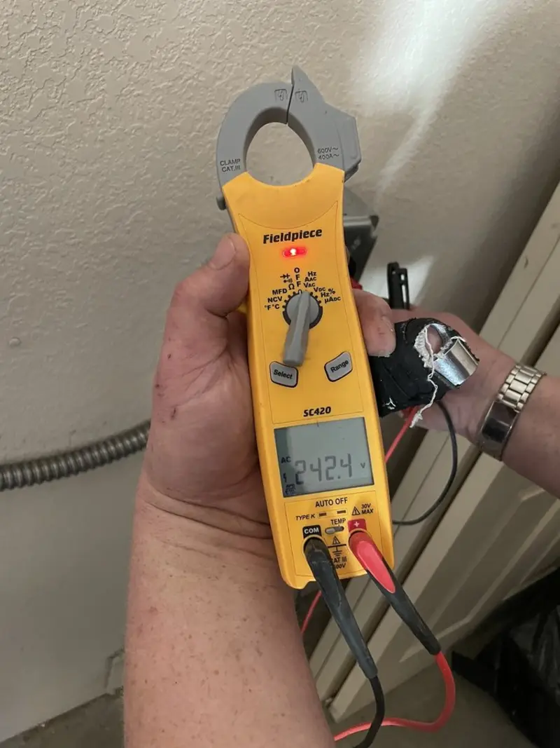 Voltage testing with clamp meter during Ceiling Fan Installation in Kettering